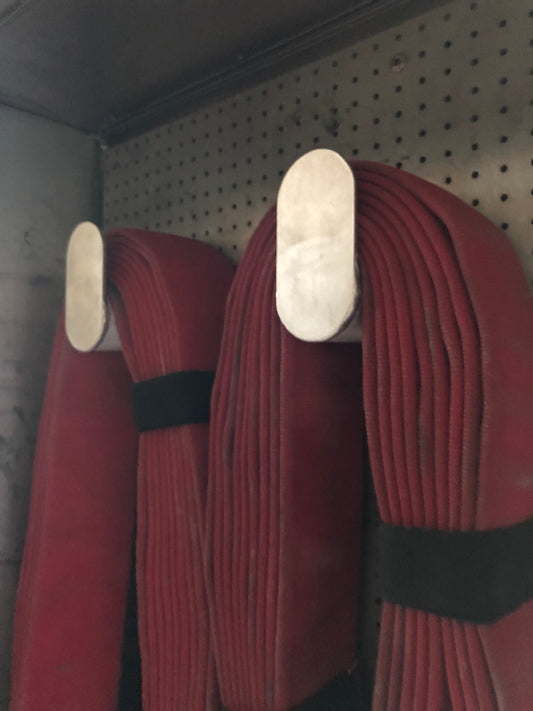 High rise hose bundle hanger